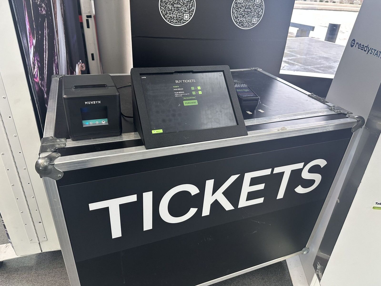 Self-service ticketing kiosk with a touchscreen, receipt printer, and scanner built into a road case