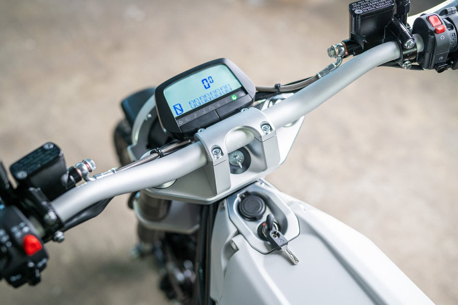 The handlebars and digital dash of a LAND District