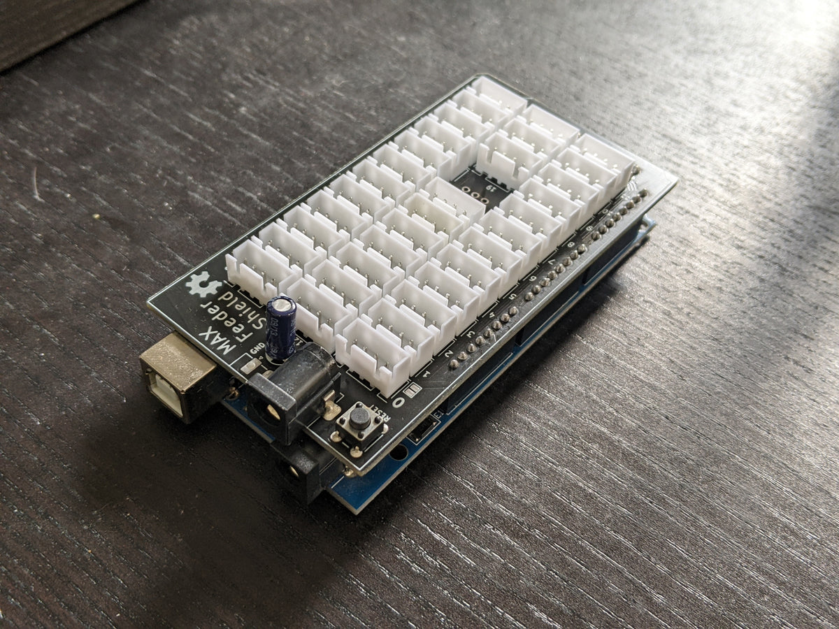 Max Feeder Shield circuit board with rows of white feeder connectors